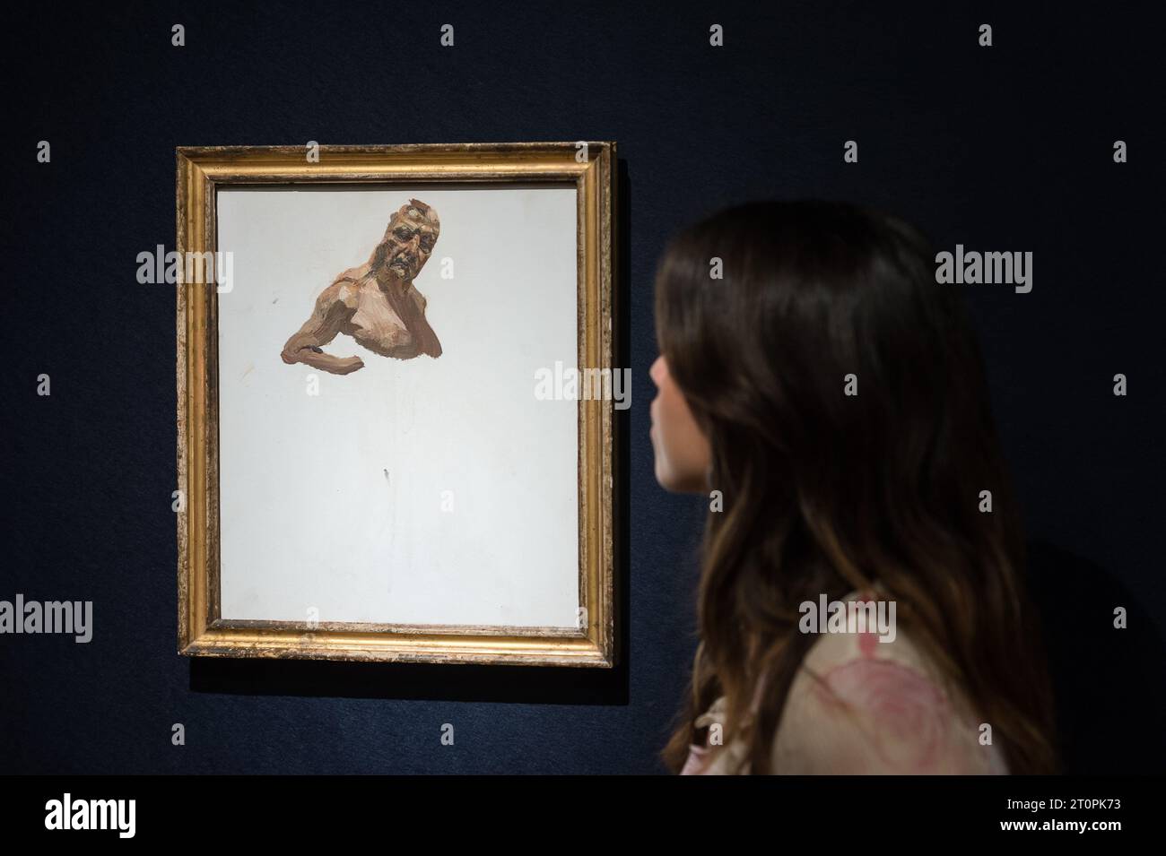 London, UK. 06th Oct, 2023. LONDON, UNITED KINGDOM - OCTOBER 06, 2023: A gallery staff member looks at a painting by Lucian Freud, Self-portrait (Fragment), 1986, estimate £300,000 - 500,000 during a photocall at Christie's auction house showcasing the highlights of 20th/21st Century Evening Sale in London, United Kingdom on October 06, 2023. (Photo by WIktor Szymanowicz/NurPhoto) Credit: NurPhoto SRL/Alamy Live News Stock Photo