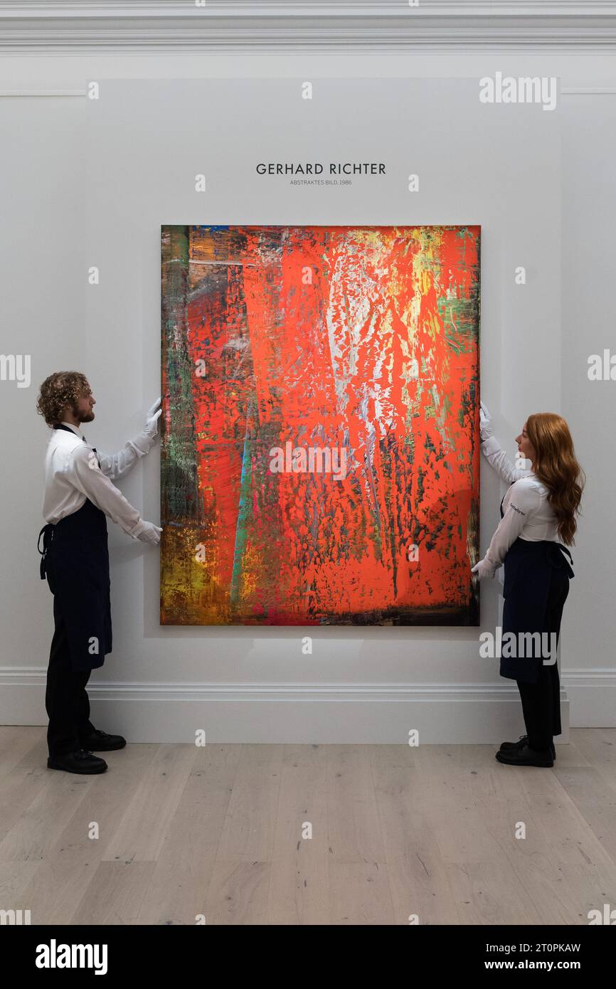 London, UK. 06th Oct, 2023. LONDON, UNITED KINGDOM - OCTOBER 06, 2023: Gallery staff members hold a painting titled ‘Abstraktes Bild' by Gerhard Richter, estimate £16-24 Million, during a photocall at Sotheby's auction house showcasing the highlights of Frieze Week Sales in London, United Kingdom on October 06, 2023. The artworks will be on view at Sotheby's auction house between 7 and 11 October before being offered during The Now and Contemporary Evening auctions on October 12. (Photo by WIktor Szymanowicz/NurPhoto) Credit: NurPhoto SRL/Alamy Live News Stock Photo