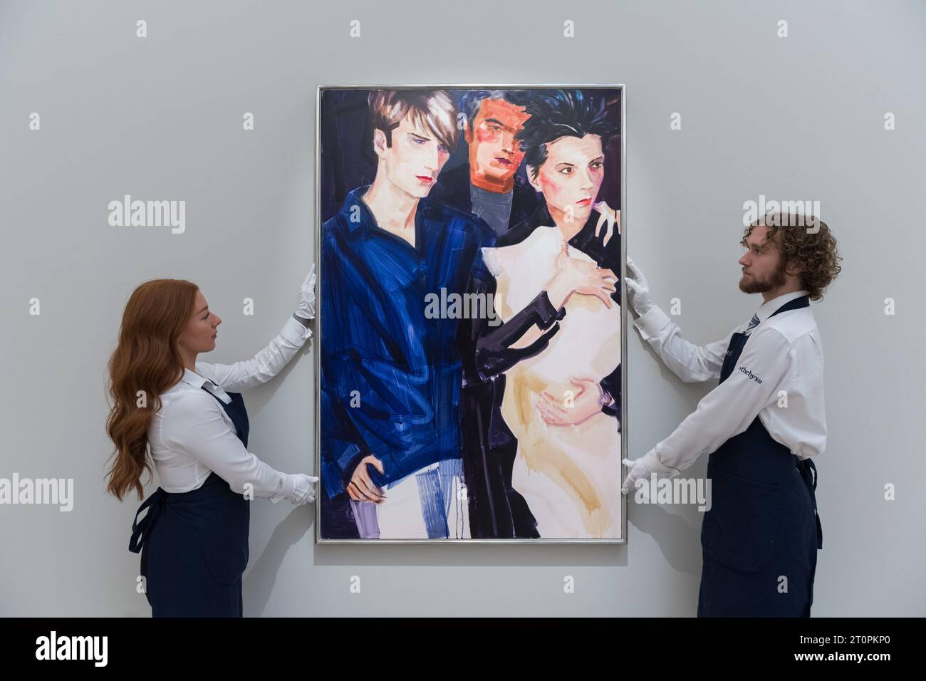 London, UK. 06th Oct, 2023. LONDON, UNITED KINGDOM - OCTOBER 06, 2023: Gallery staff members hold a painting by Elizabeth Peyton, David, Victoria and Brookyln, oil on canvas, 1999, estimate £1.2-1.8m, during a photocall at Sotheby's auction house showcasing the highlights of Frieze Week Sales in London, United Kingdom on October 06, 2023. The artworks will be on view at Sotheby's auction house between 7 and 11 October before being offered during The Now and Contemporary Evening auctions on October 12. (Photo by WIktor Szymanowicz/NurPhoto) Credit: NurPhoto SRL/Alamy Live News Stock Photo