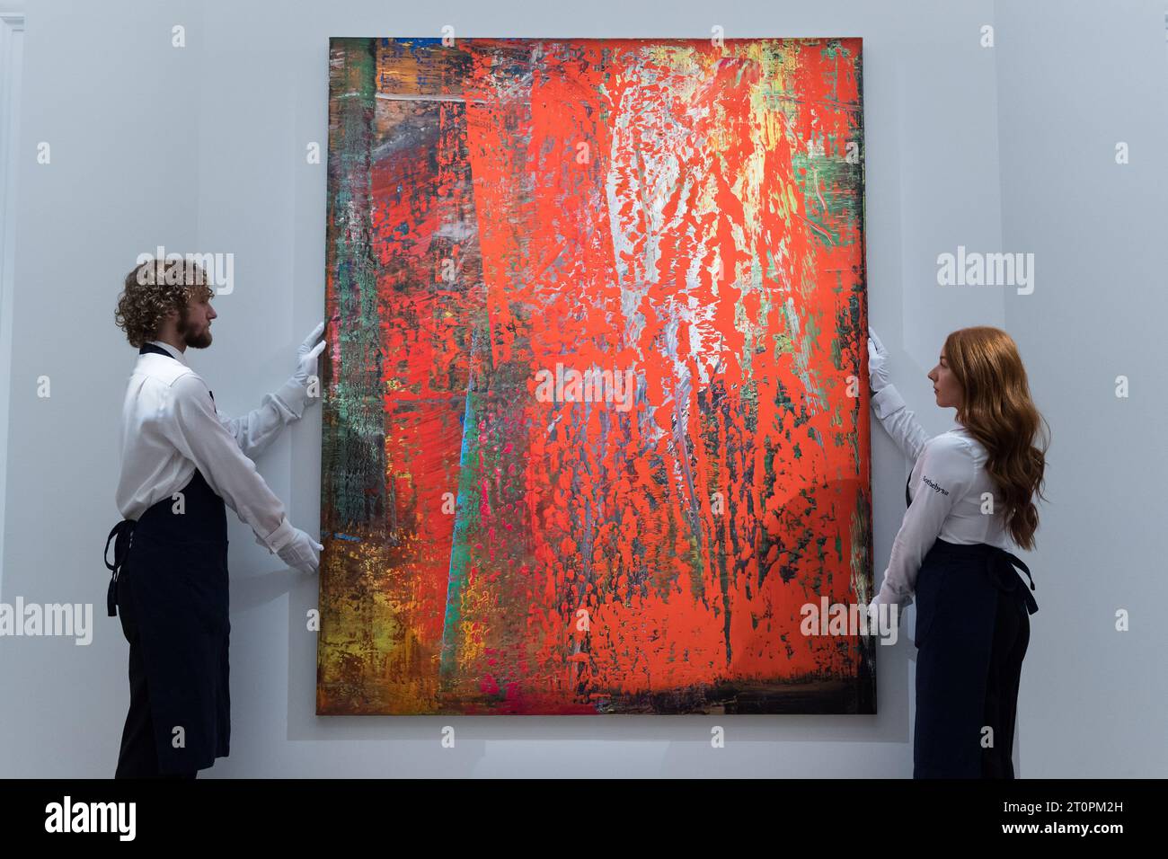 London, UK. 06th Oct, 2023. LONDON, UNITED KINGDOM - OCTOBER 06, 2023: Gallery staff members hold a painting titled ‘Abstraktes Bild' by Gerhard Richter, estimate £16-24 Million, during a photocall at Sotheby's auction house showcasing the highlights of Frieze Week Sales in London, United Kingdom on October 06, 2023. The artworks will be on view at Sotheby's auction house between 7 and 11 October before being offered during The Now and Contemporary Evening auctions on October 12. (Photo by WIktor Szymanowicz/NurPhoto) Credit: NurPhoto SRL/Alamy Live News Stock Photo