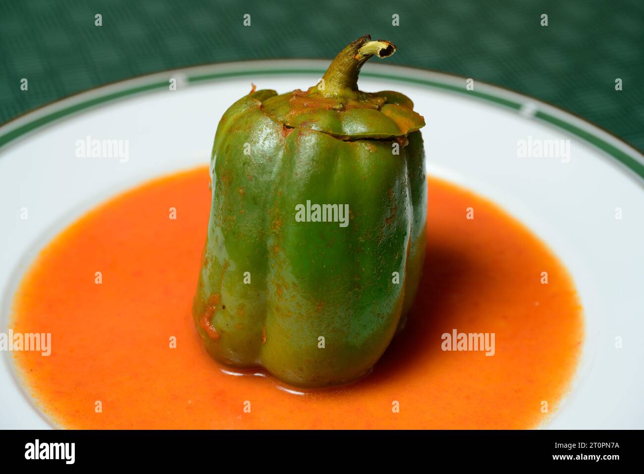 Stuffed Green Bell Pepper or Gefullte Paprika with Tomato Sauce Austrian Style Stock Photo