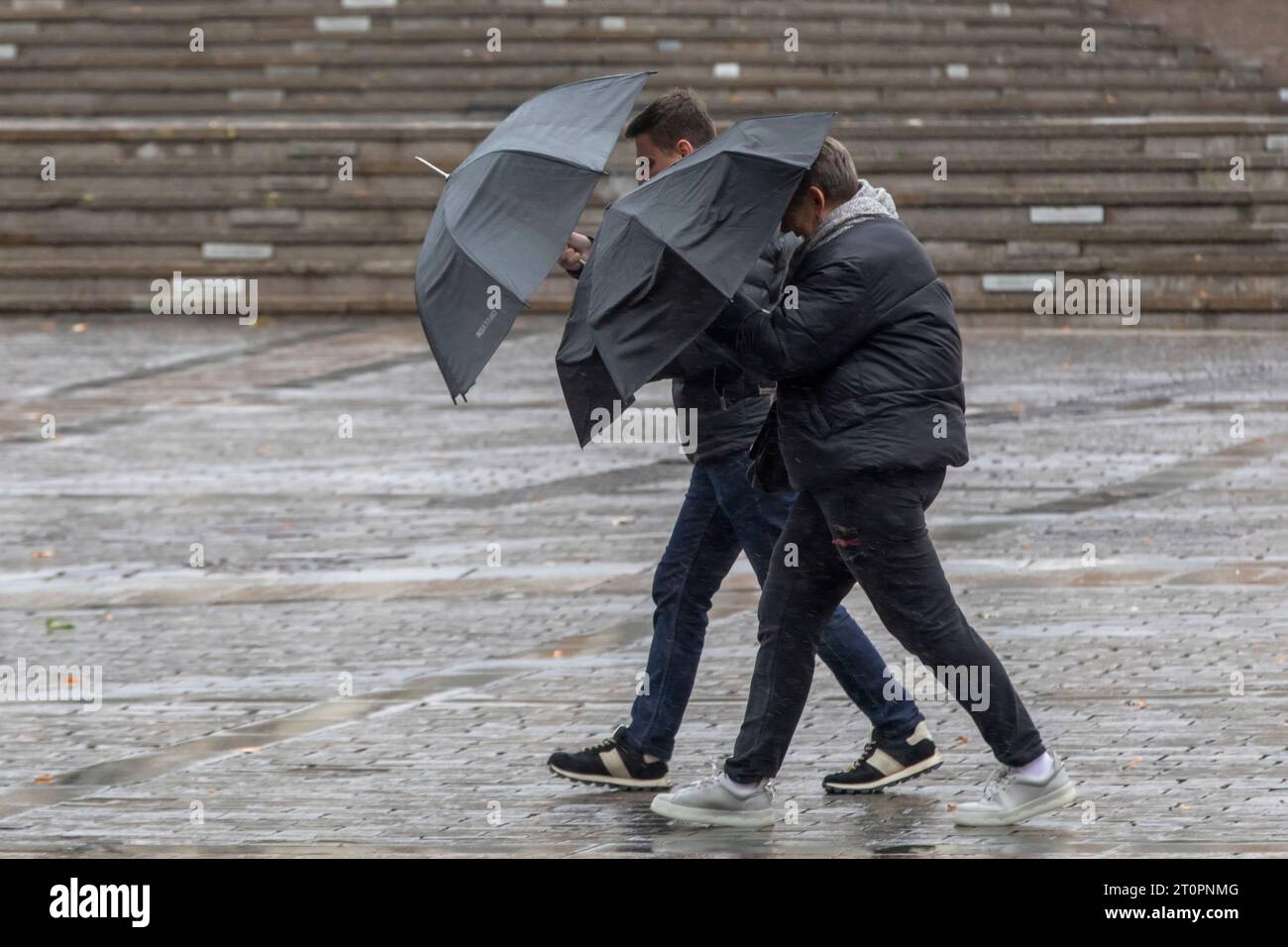 Moscow, Russia. 8th of October, 2023. People walk in Red Square during the rain and windy wqeather in Moscow, Russia. Credit: Nikolay Vinokurov/Alamy Live News Stock Photo
