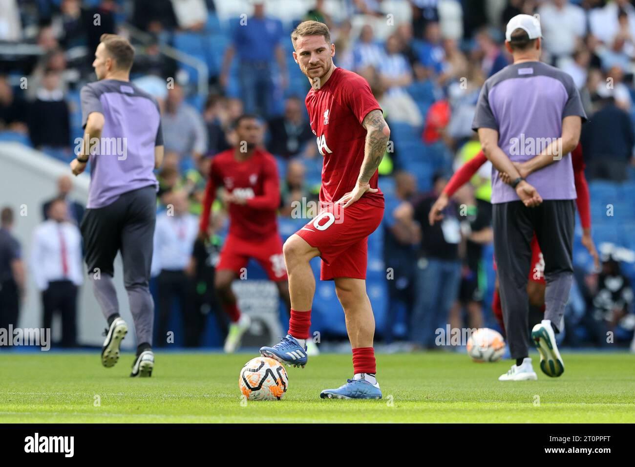 Alexis Mac Allister warms up before kick off for Liverpool FC at the