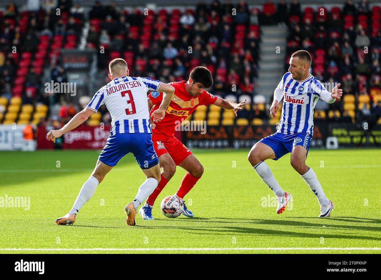 Farum, Denmark. 08th Oct, 2023. Zidan Sertdemir (21) of FC Nordsjaelland seen in between Nicklas Mouritsen (3) and Tom Trybull (15) of Odense BK during the 3F Superliga match between FC Nordsjaelland and Odense BK at Right to Dream Park in Farum. (Photo Credit: Gonzales Photo/Alamy Live News Stock Photo