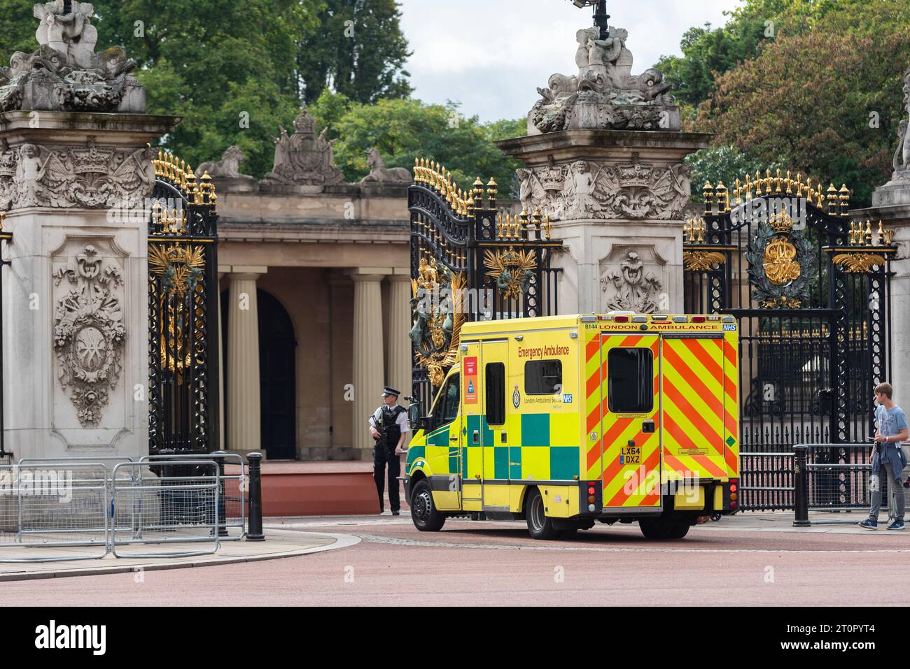 NHS ambulance arriving at Buckingham Palace gate, London, UK, with