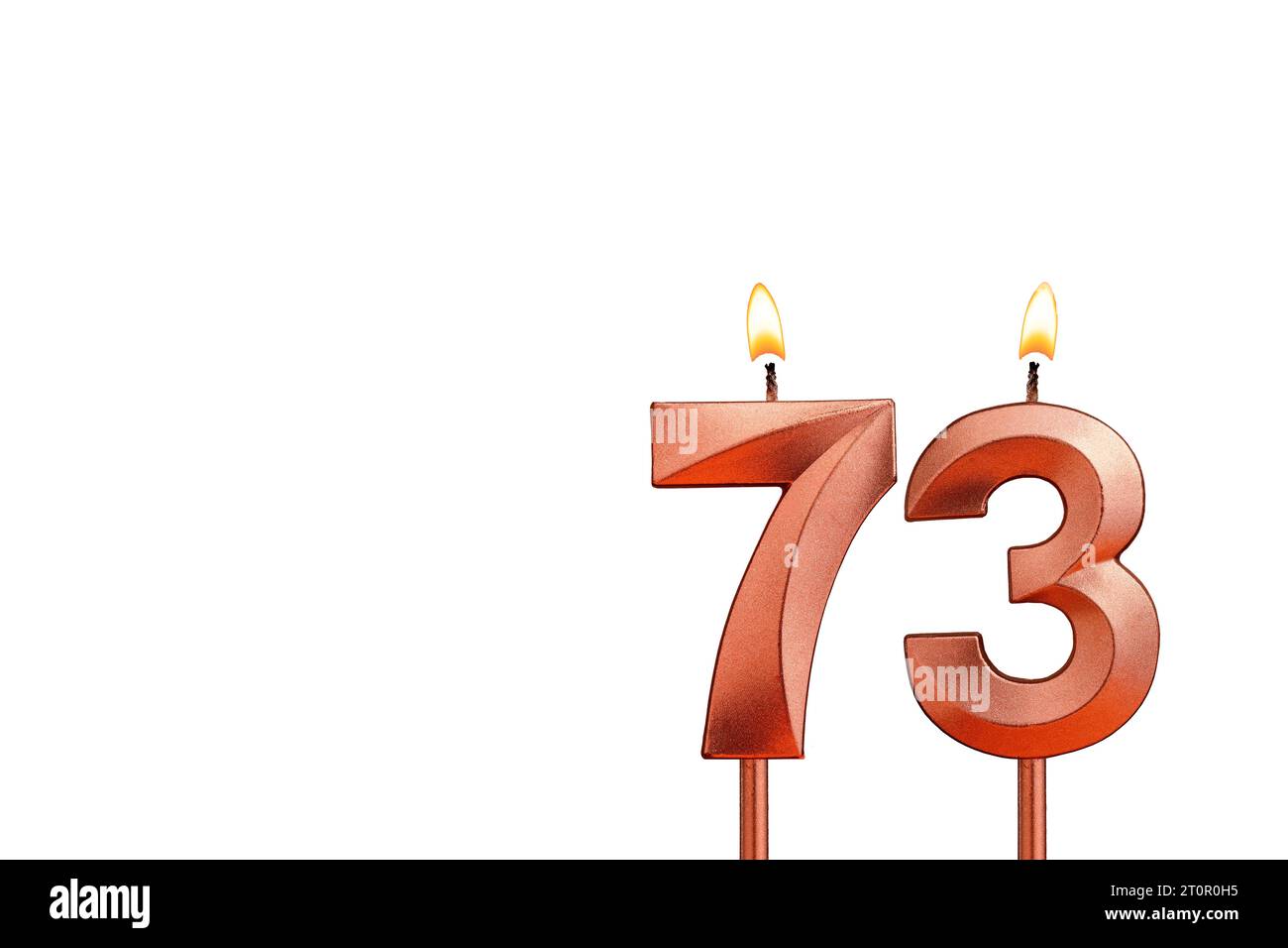 Birthday candle number 73 on white background Stock Photo