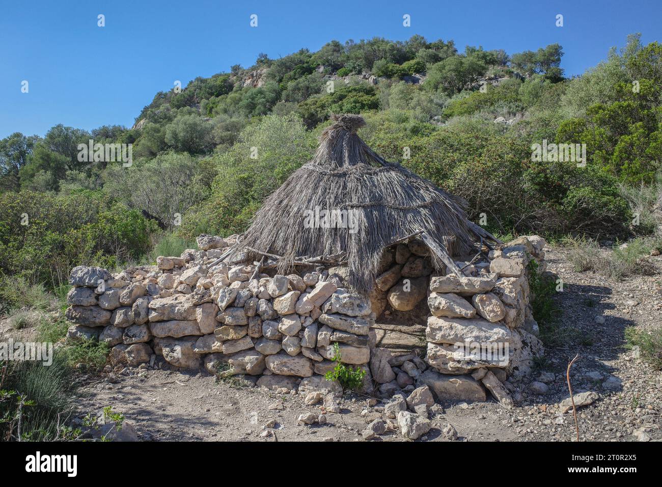 Mallorca, Spain - 8 Oct, 2023: Ancient charcoal huts at the Puig de sa Marisca archaeological site Stock Photo