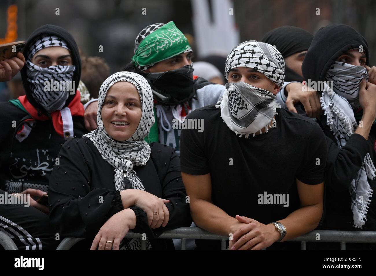 People waring the keffiyeh attend a pro palestinian rally across the