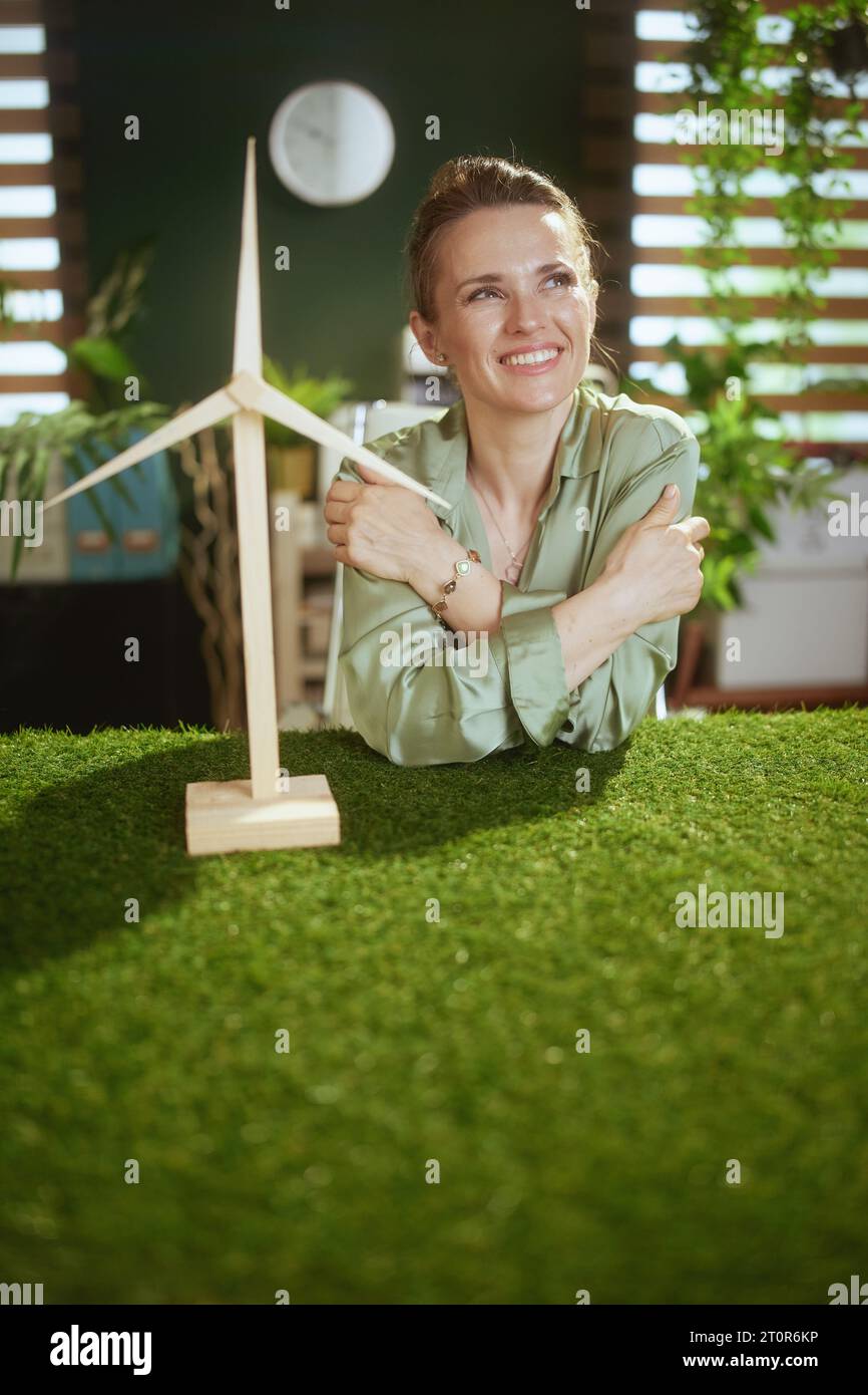 Eco trends. pensive modern small business owner woman in green blouse ...