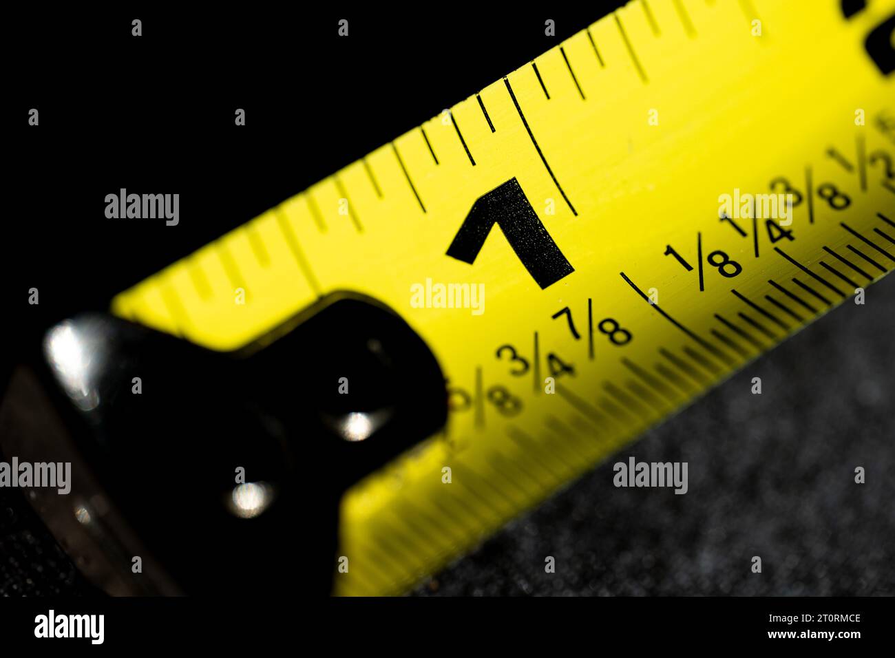 Macro Photograph of a Tape Measure with Dark Background Stock Photo