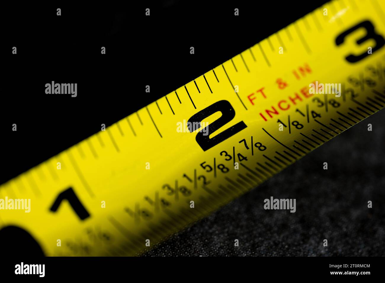 Macro Photograph of a Tape Measure with Dark Background Stock Photo