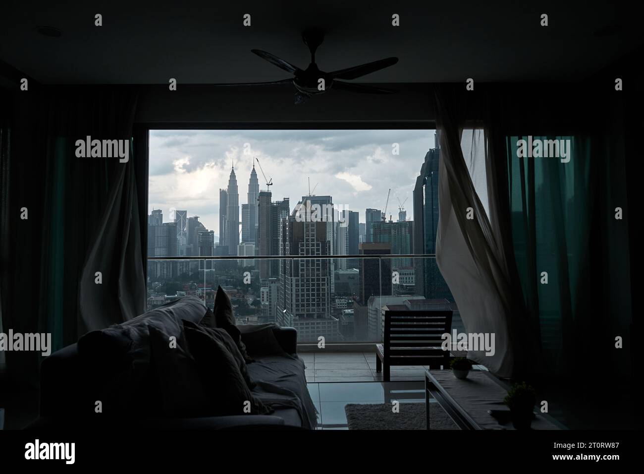 The Wind Rustles The wind rustles the curtain of the panoramic window with a cityscape ...