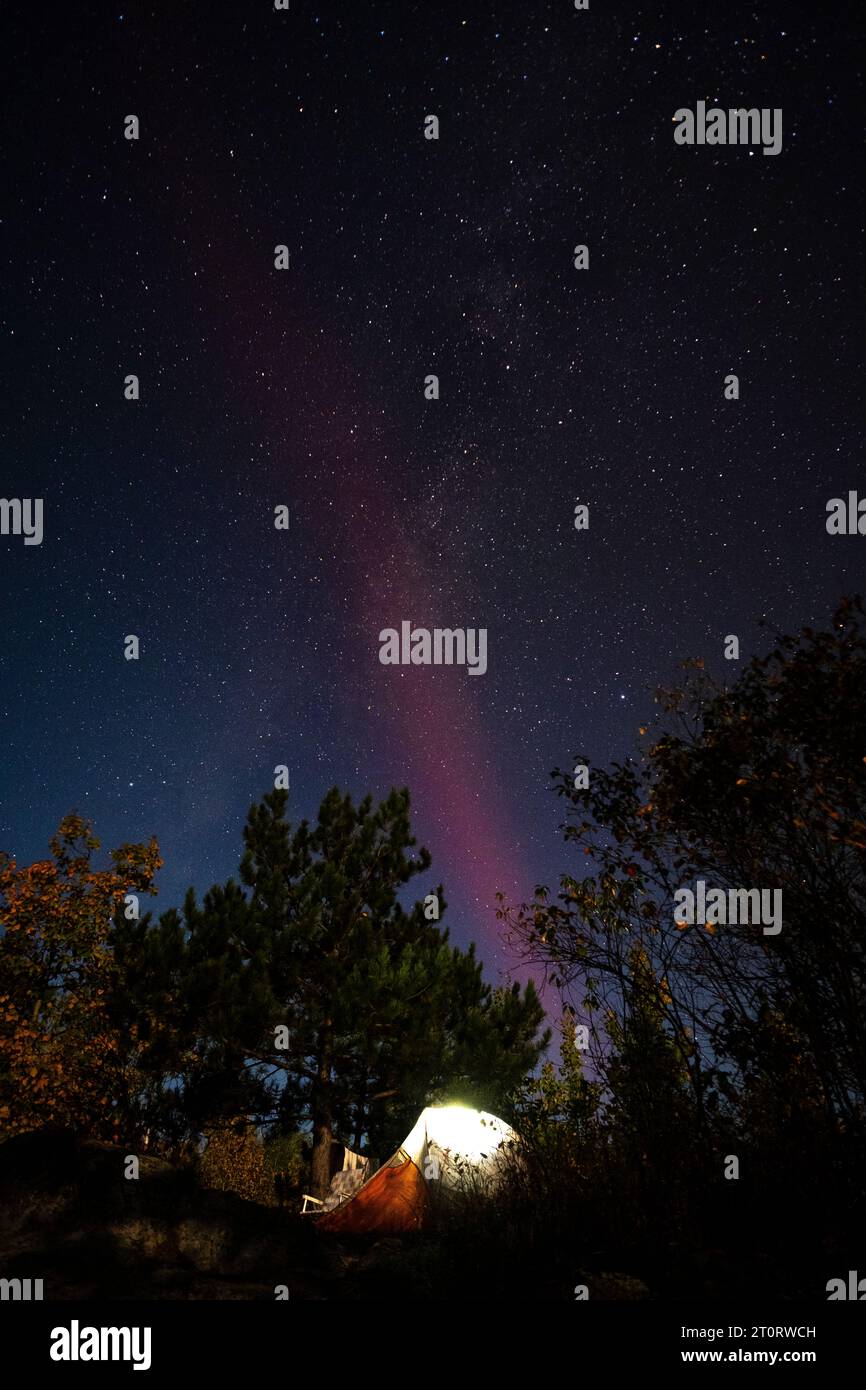 Northern Lights over a campsite in the Boundary Waters of northern Minnesota, USA Stock Photo