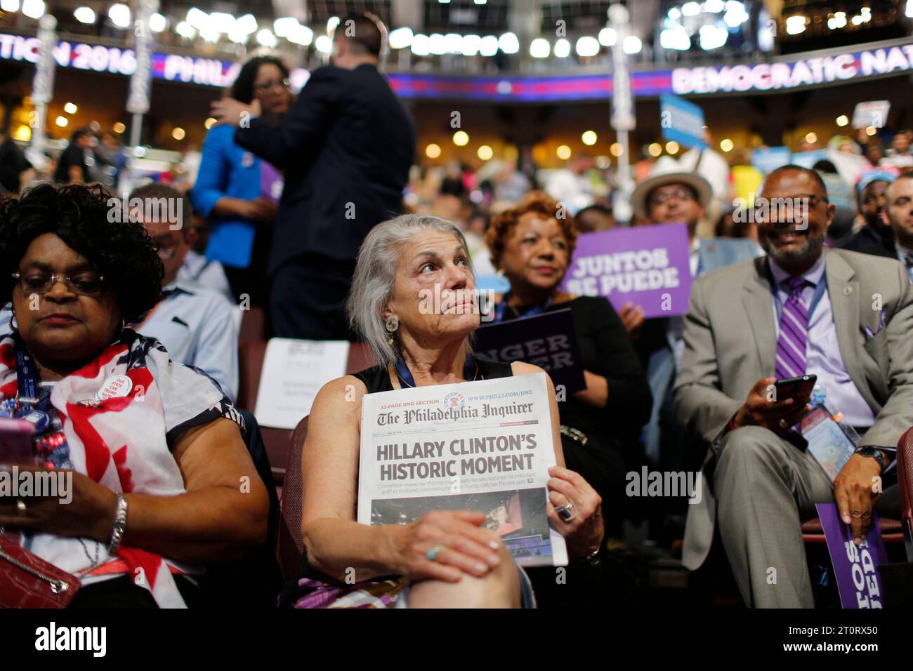 07272016 - Philadelphia, Pennsylvania, USA: A California delegate holds the front page of the Philadelphia Enquirer with the headline, 'Hillary Clinton's Historic Moment,' during the third day of the Democratic National Convention. (Jeremy Hogan/Polaris) Stock Photo