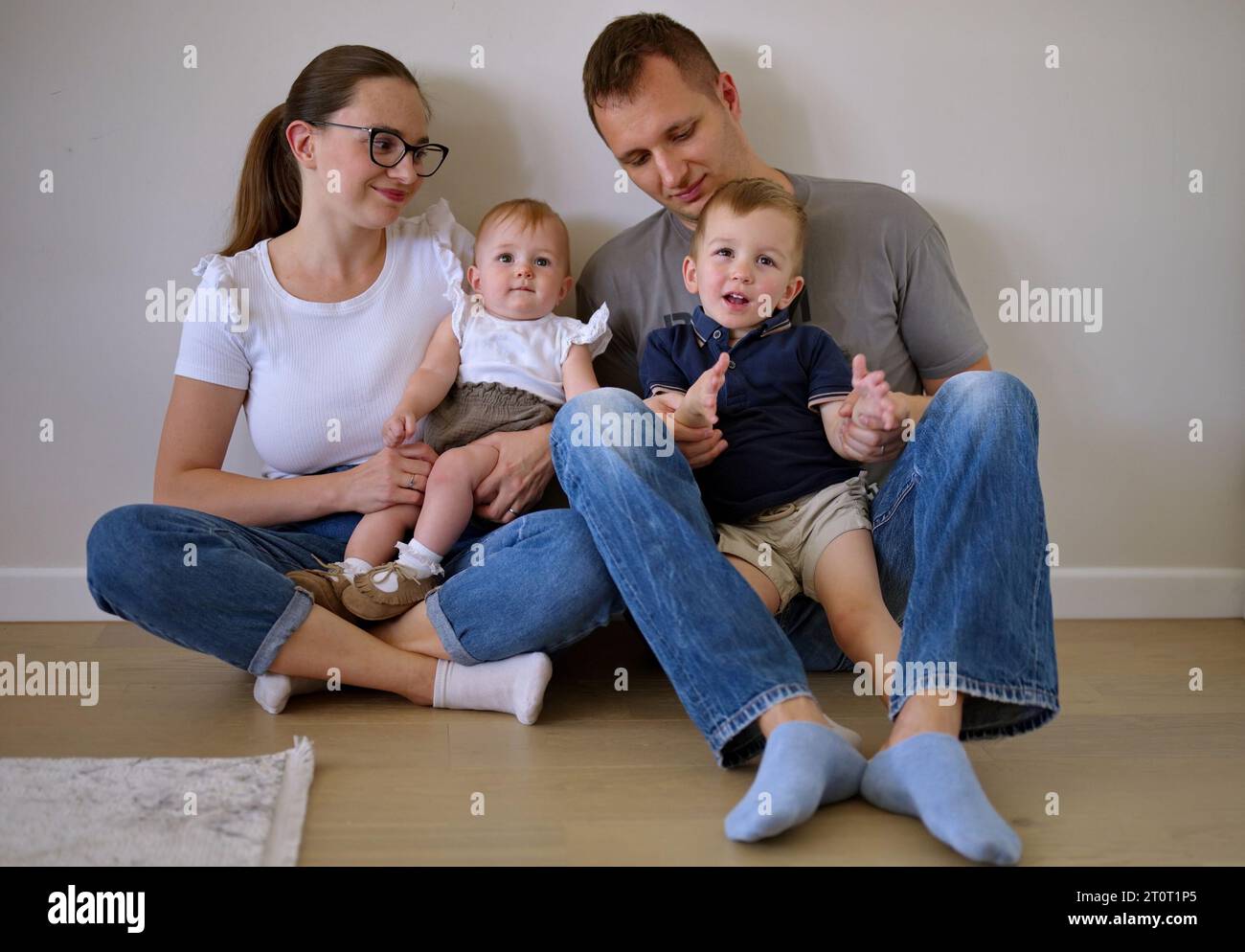 Portrait of couple with toddler and little baby girl Stock Photo