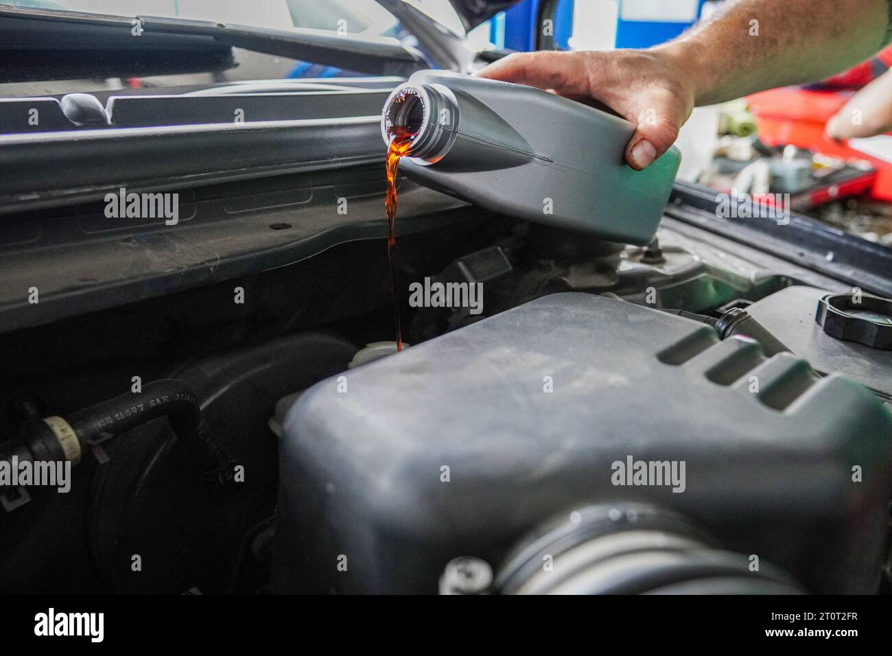 Close up view of a Maintenance Car service auto oil change, motor