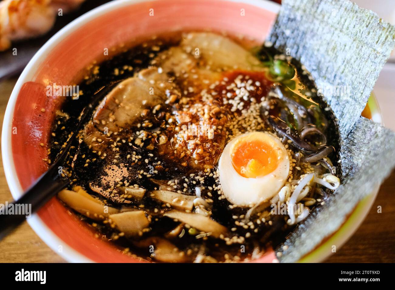 A bowl of tonkotsu ramen with black garlic oil, chargrilled chashu