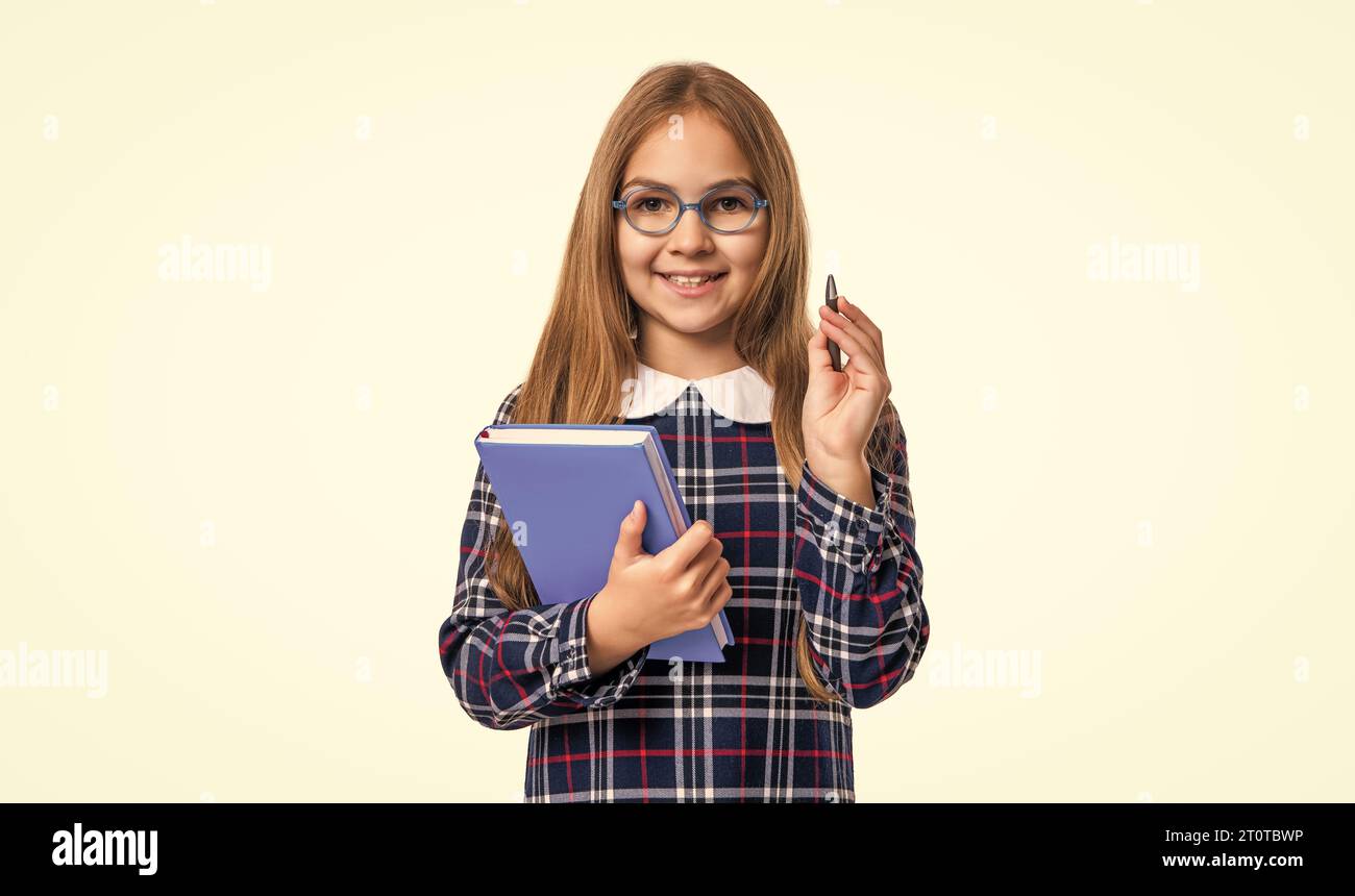 photo of smiling school girl reader hold diary. school girl reader with ...