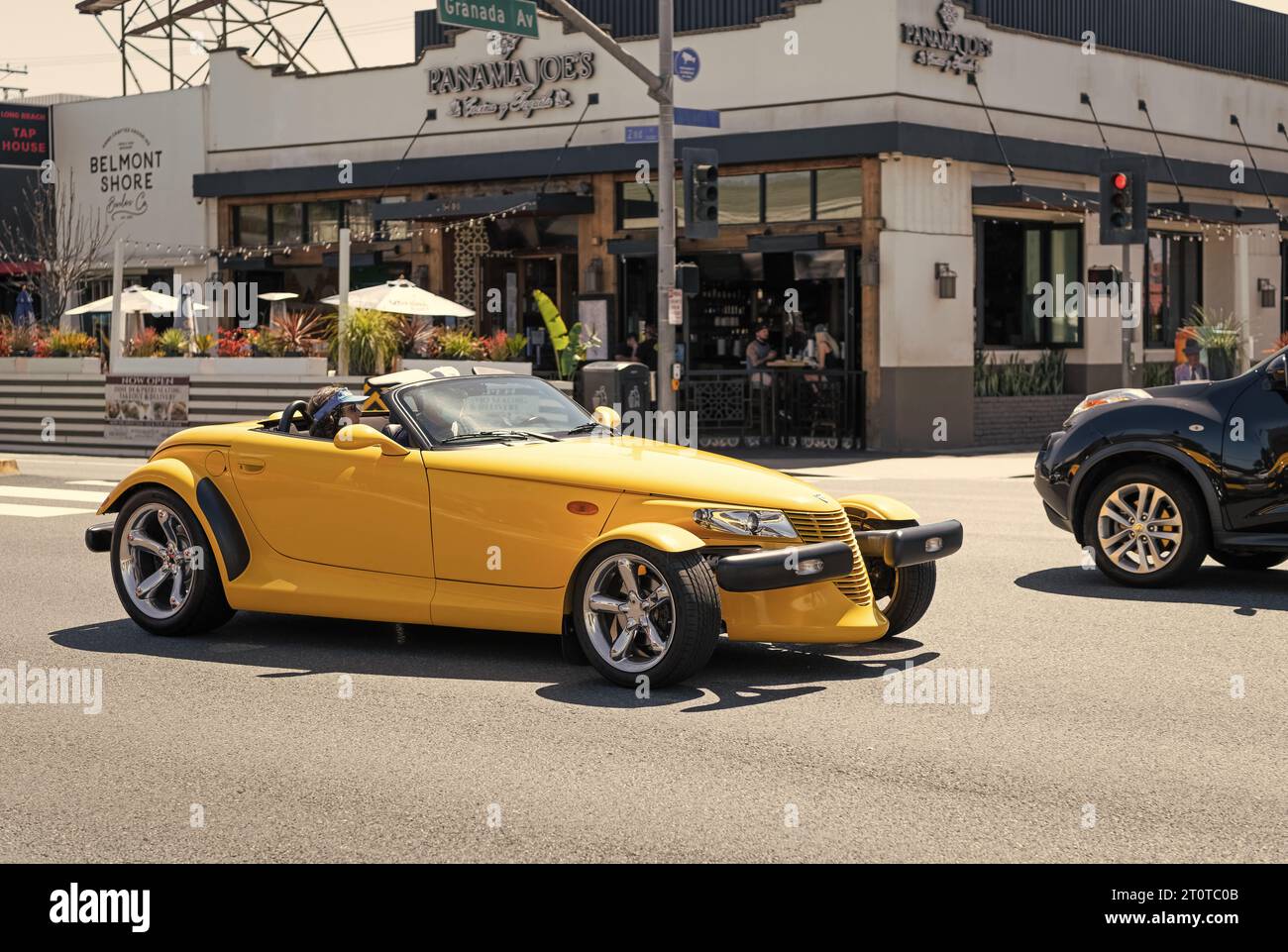 Long Beach, California USA - March 31, 2021: classic car of yellow Chrysler Plymouth Prowler on road Stock Photo