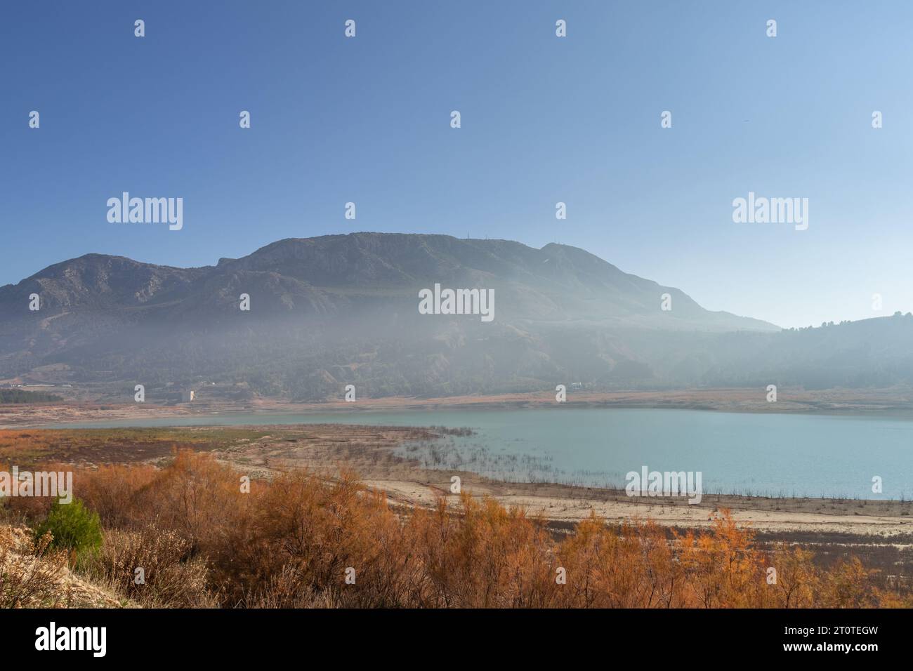 Foggy haze above the Negratin lake in Andalusia, Spain, on a sunny winter day Stock Photo