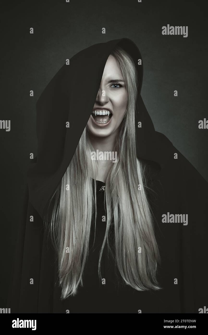 Black hooded female vampire Stock Photo