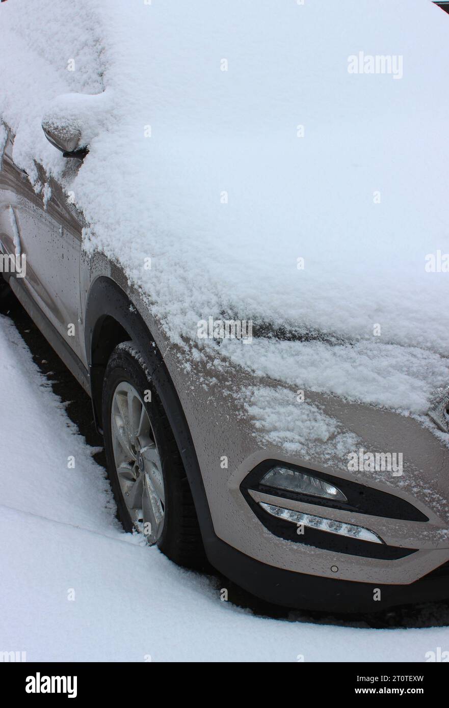 Snow Cap On A Hood, Windshield And Side Mirror Of Vehicle Parked On Asphalt Stock Photo Stock Photo