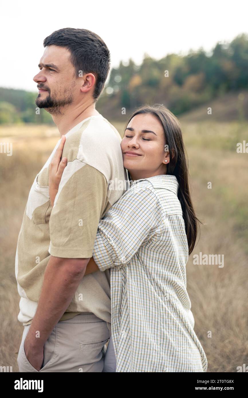Happy mature man and woman hugging while standing in the field Stock ...