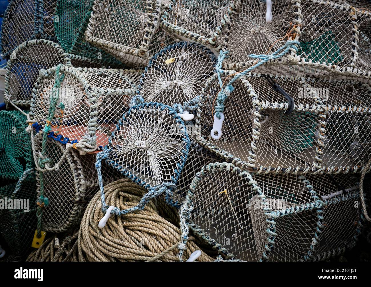 A pile of Crab and Lobster baskets on the Quay side at Poole in Dorset, ENgland. Stock Photo