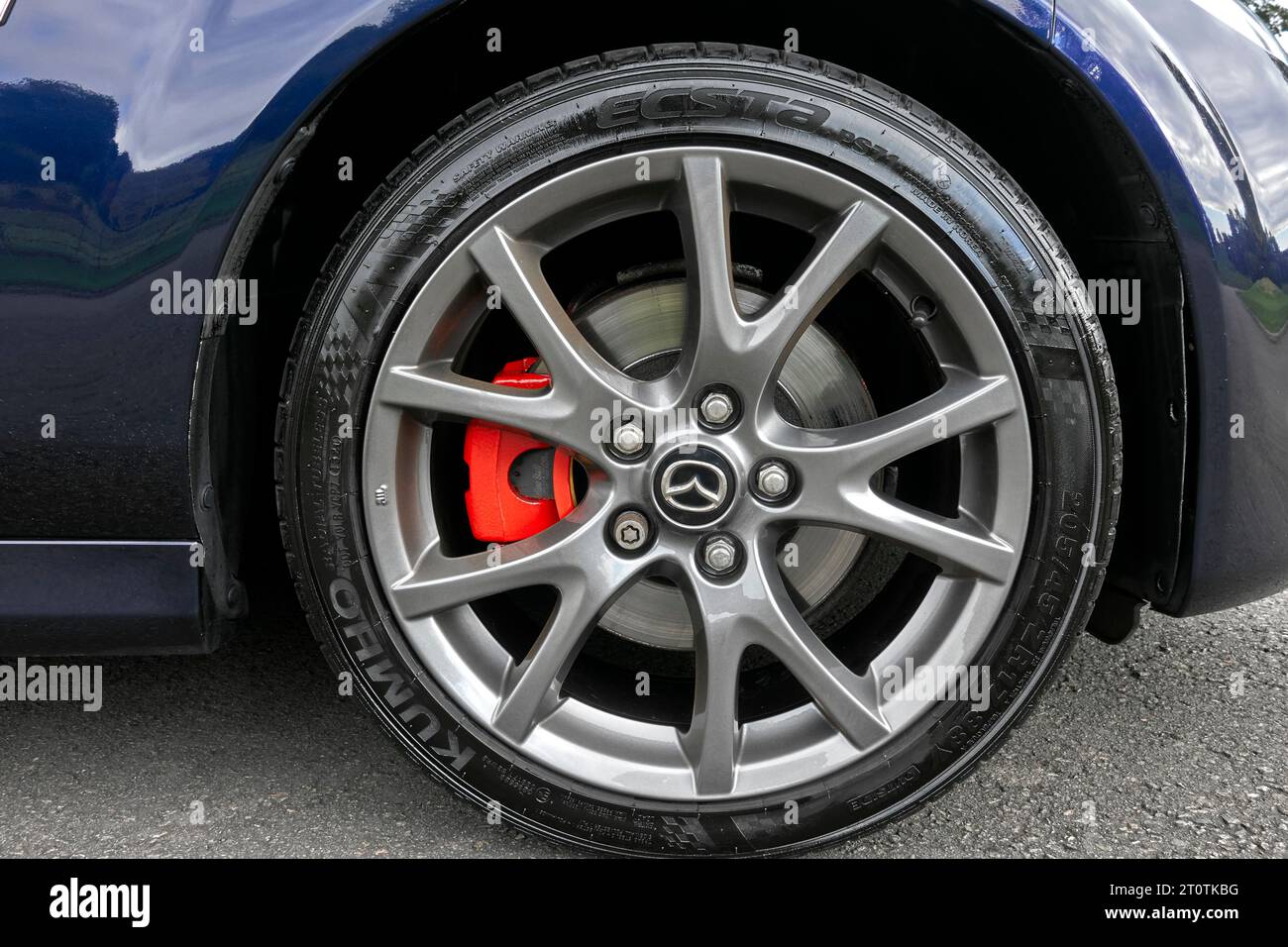Red disc brake calipers on a Mazda MX5 Venture Edition Japanese sports