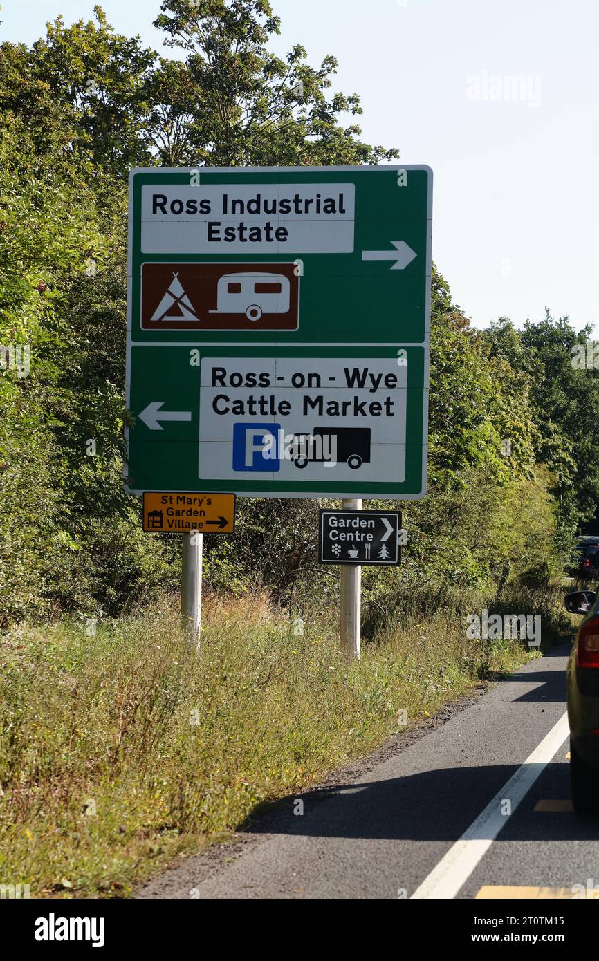A clearly visible retro reflective roadside sign for Ross on Wye industrial estate and cattle A clearly visible retro reflective roadside sign for Ross on Wye industrial estate and cattle