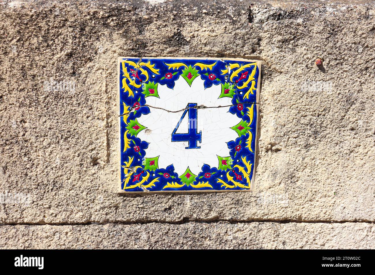 Greek style house number 4 (four) ceramic tile Stock Photo