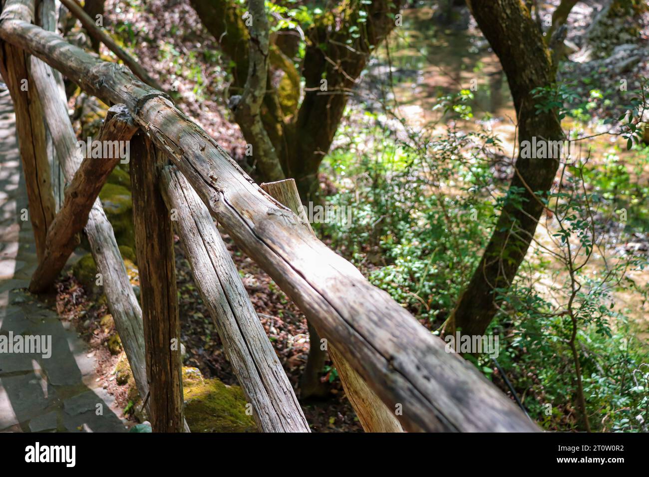 Wooden safety rail located on the walking trail at Butterfly Valley, Rhodes, Greece Stock Photo