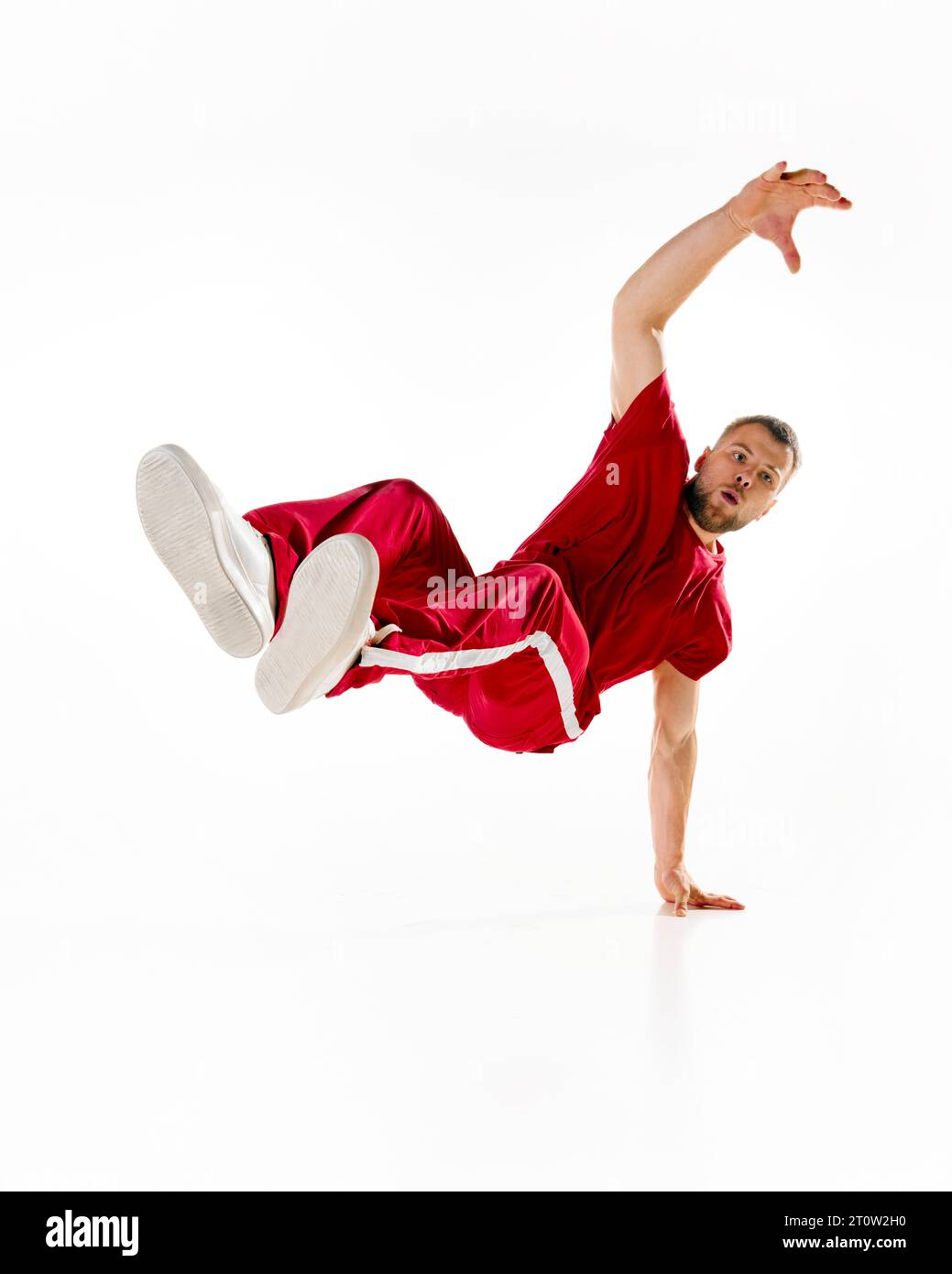 Air twist. Young sportive man, bboy dancing hiphop, breakdance on one