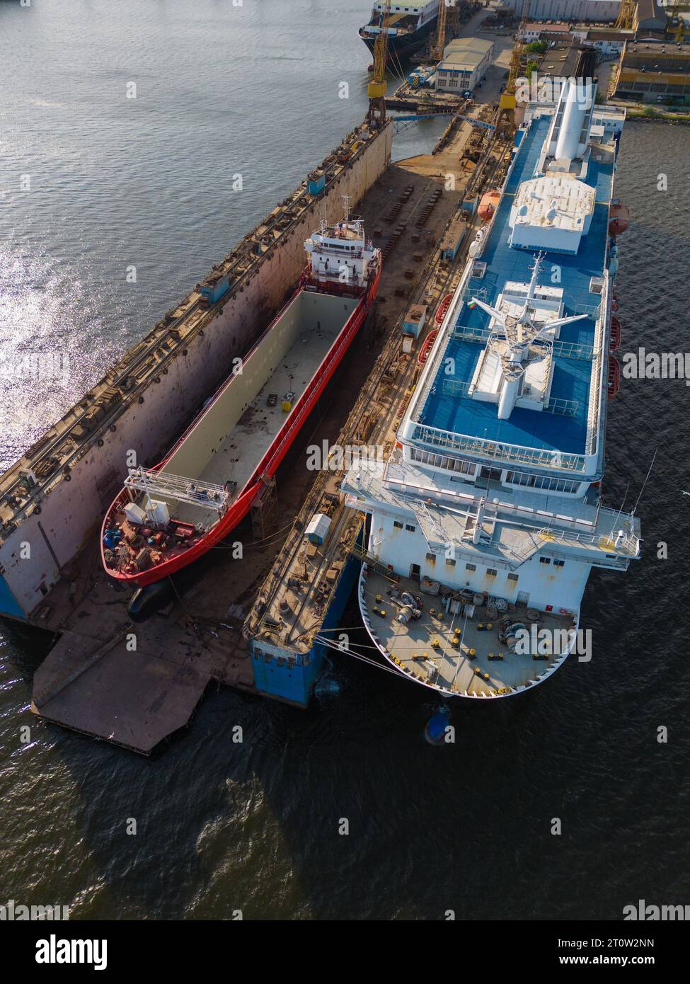 aerial top view shipyard dry dock maintenance and repair cargo ship ...