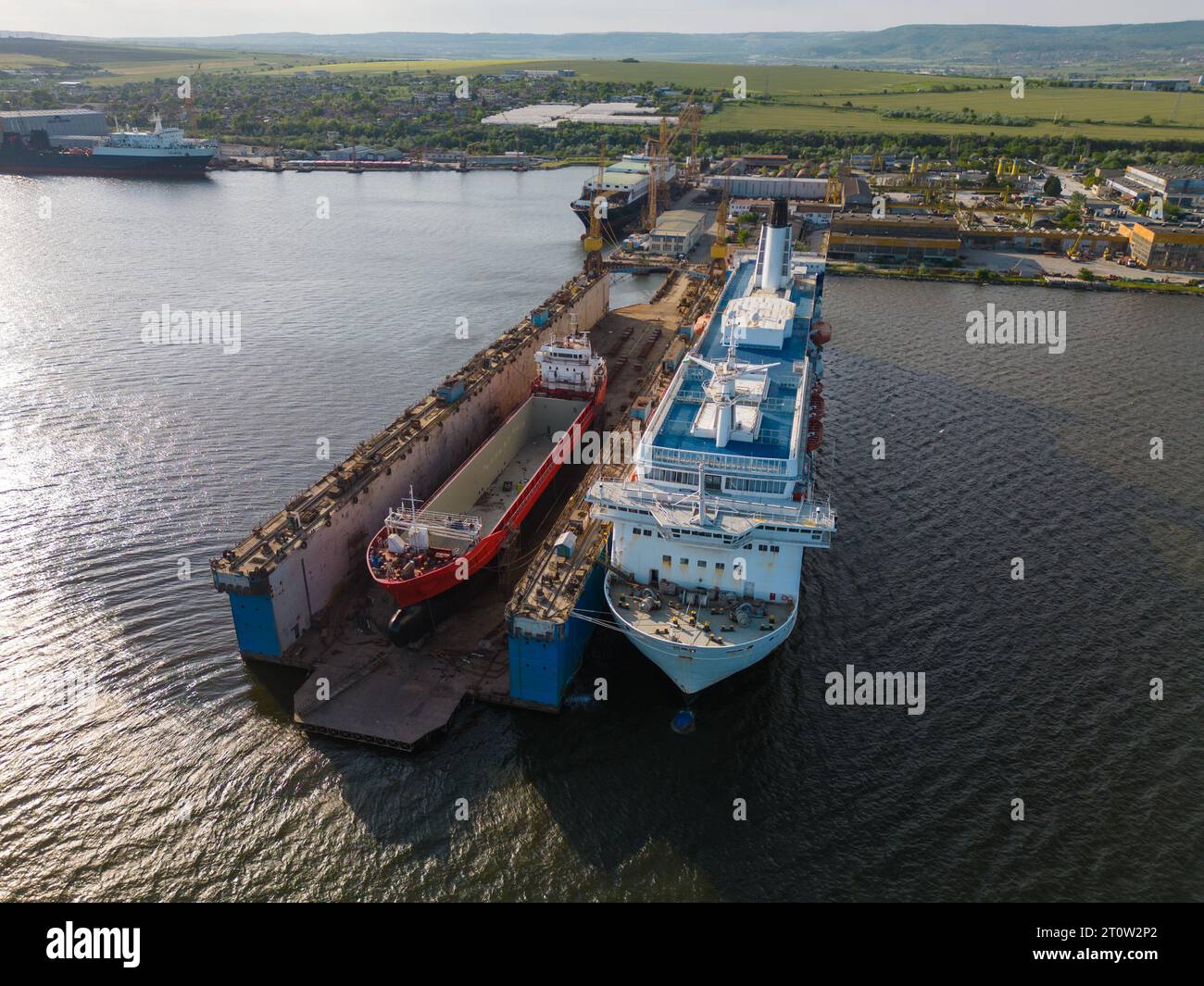 aerial top view shipyard dry dock maintenance and repair cargo ship ...