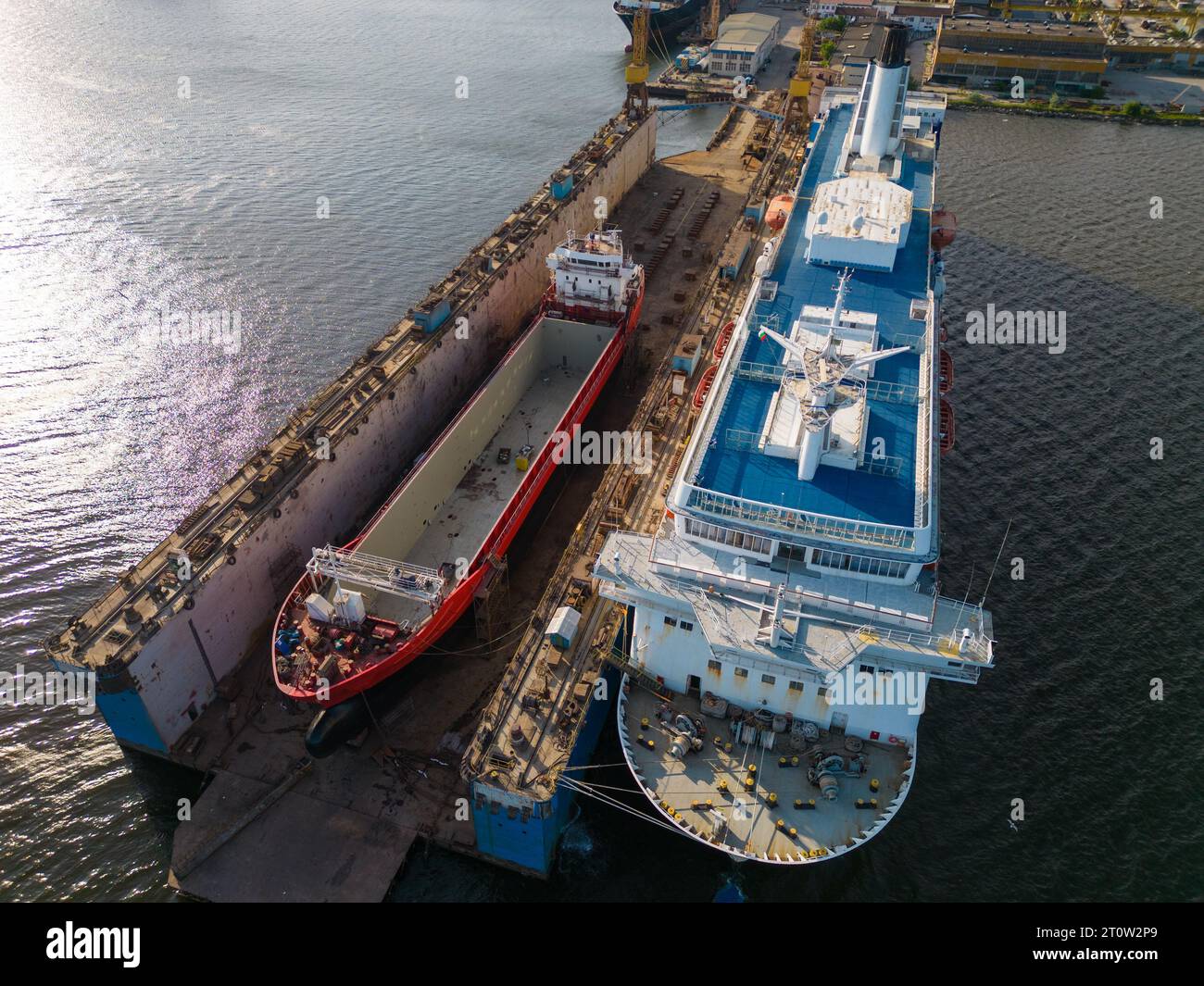 aerial top view shipyard dry dock maintenance and repair cargo ship ...