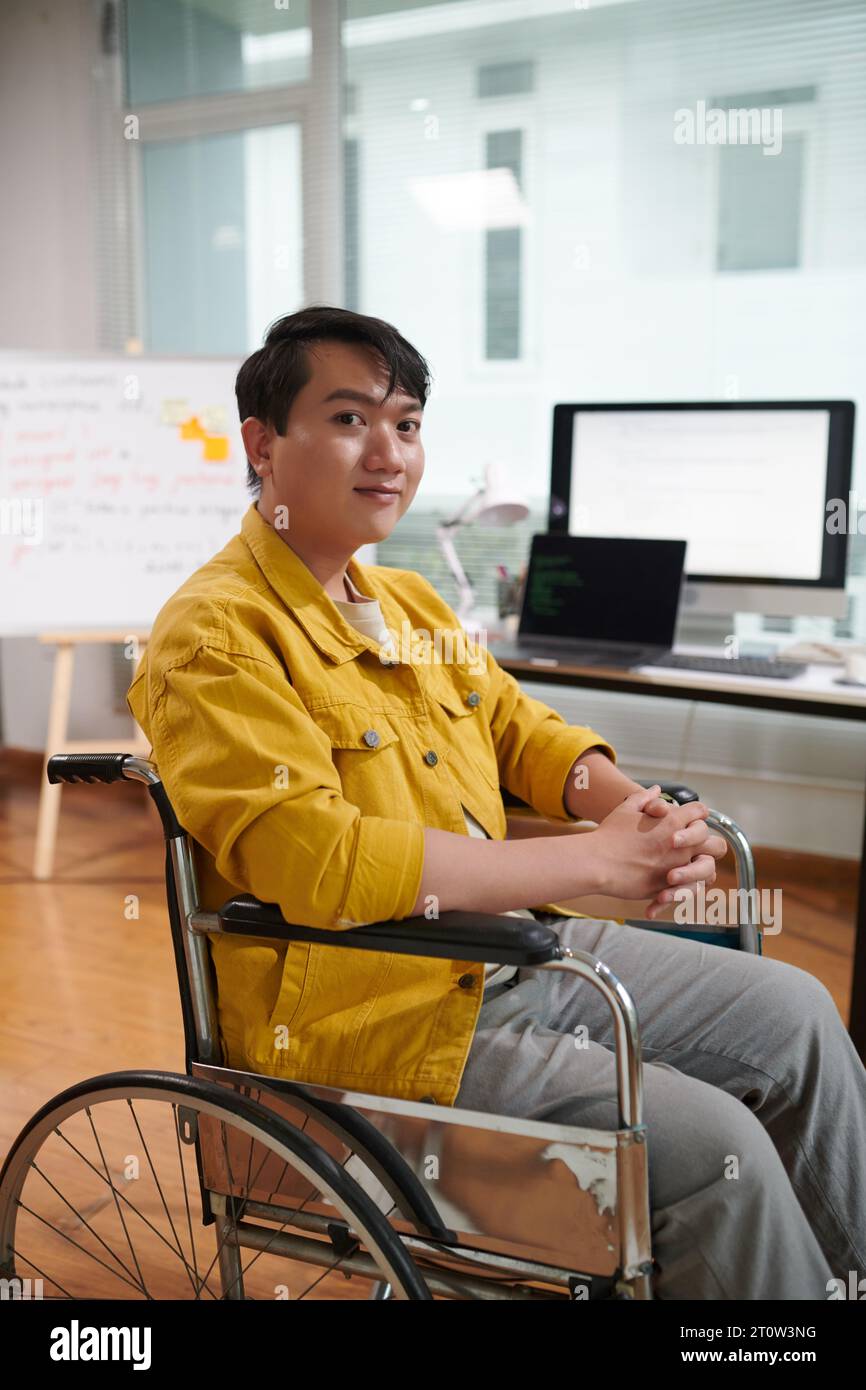 Disability Man Happy proud young Asian man with disability working Stock Photo - Alamy