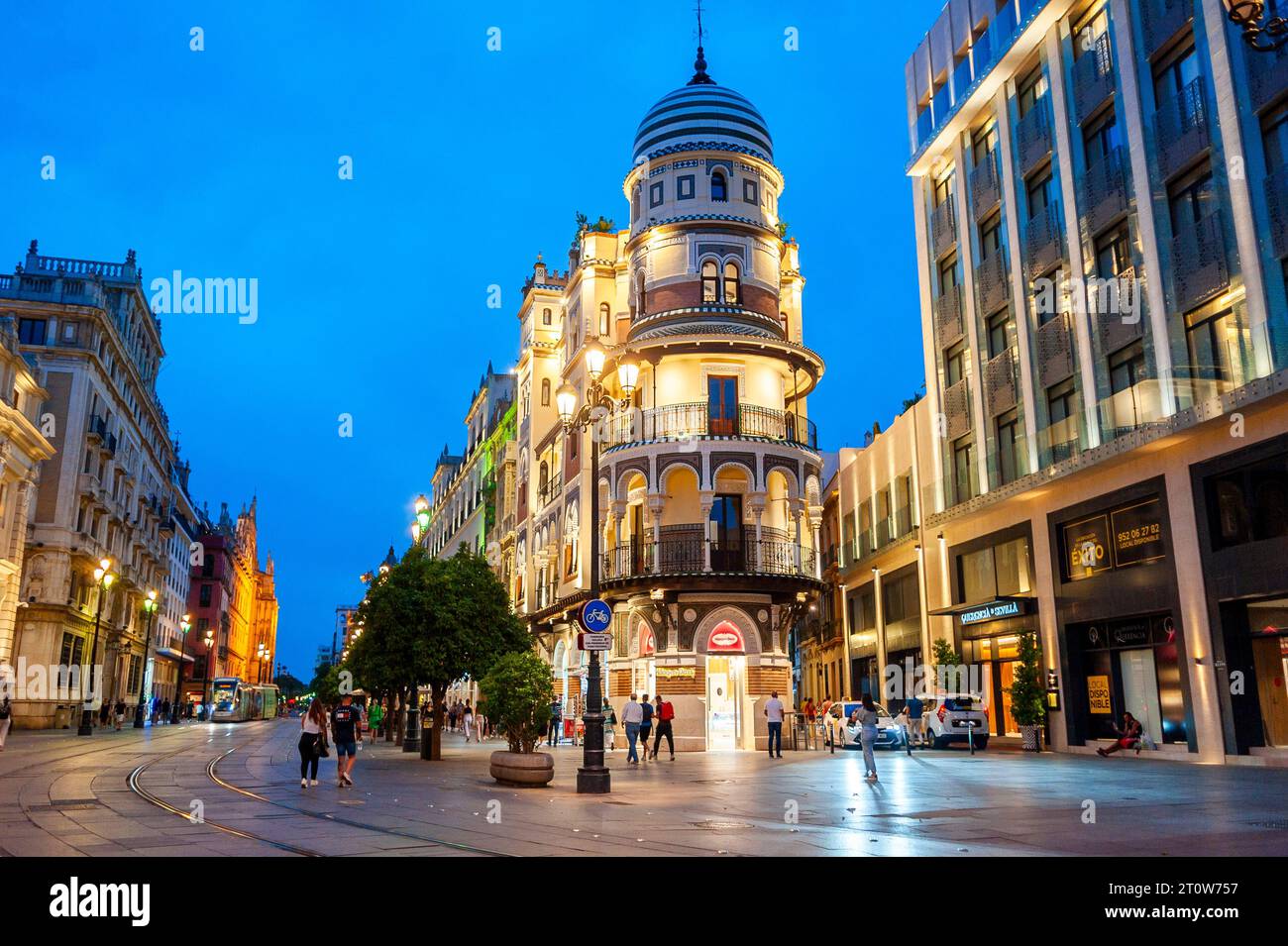 Seville, Spain, Wide Angle View, Street Scene, Tourists Visiting City Center, Night, Lights, 'Ave. de la Constitution' Stock Photo