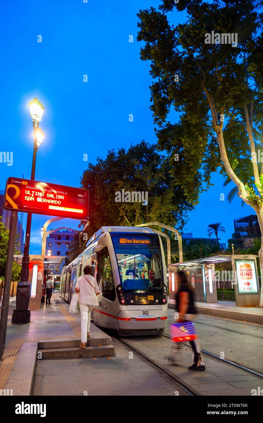 Seville, Spain, People, Public Transport, Tram, at Night, Lights, San Bernardo Station, Street Scene, neighborhoods Stock Photo