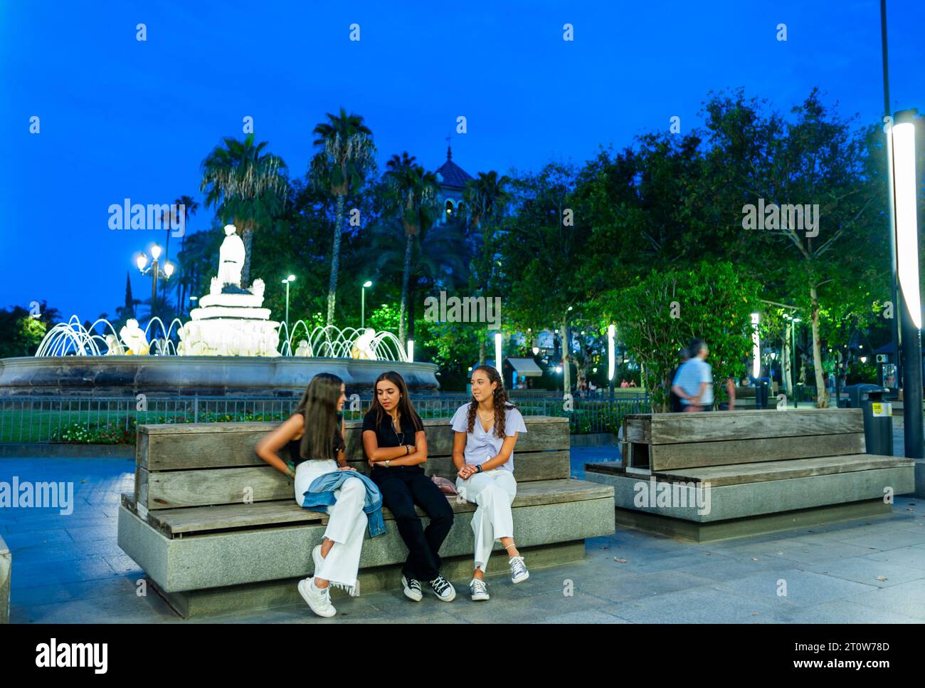 Seville, Spain, Street Scene, Small Group People, Girls, Sitting, Tourists Visiting City Center, Night, Ave. de la Constitution, neighborhoods Stock Photo