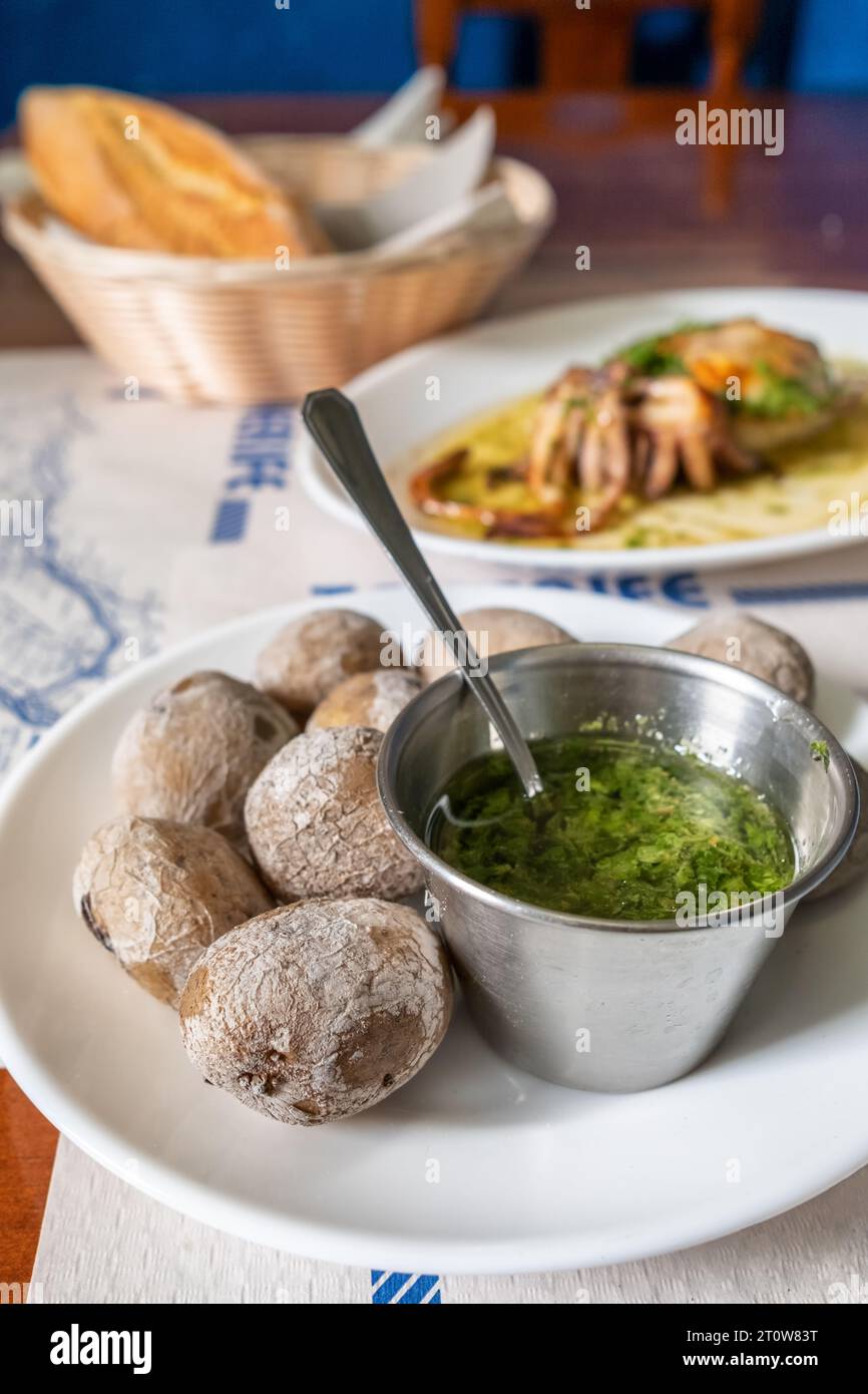 Papas arrugadas, wrinkled potatoes, in the traditional Canarian restaurant on Tenerife island, Spain. Stock Photo