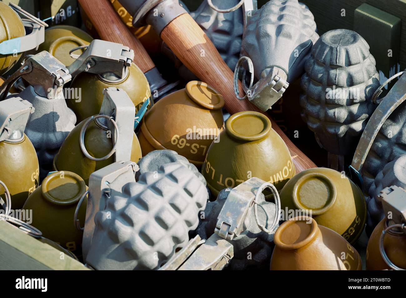 Ammunition box full of various types of grenades. Lemon, pineapple, and