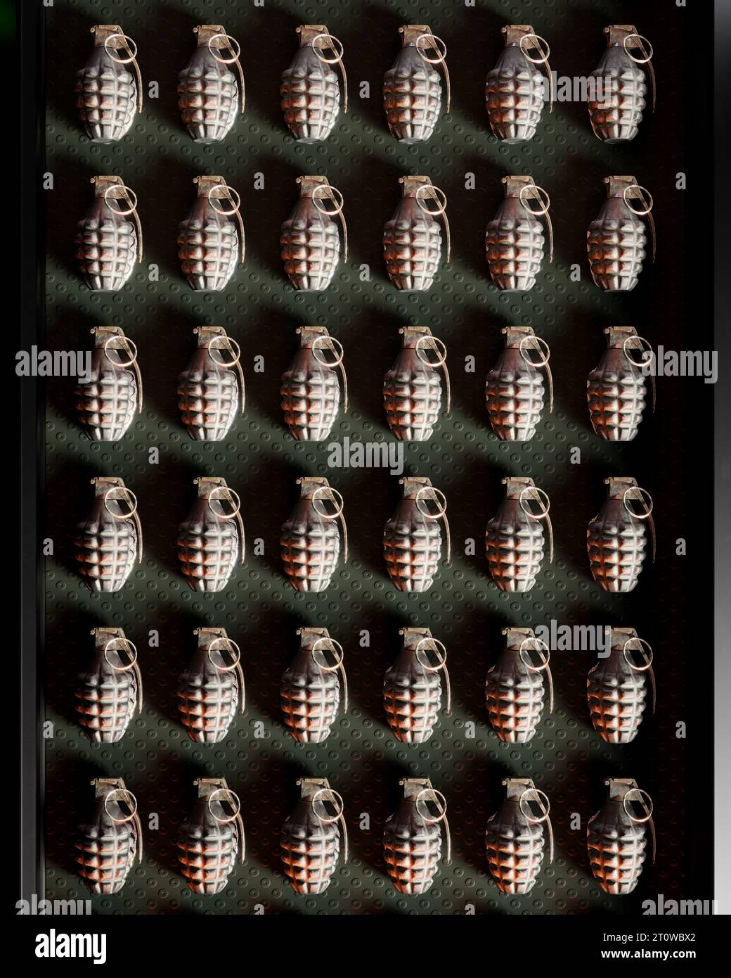 This image features a conveyor belt filled with hand frag grenades, a