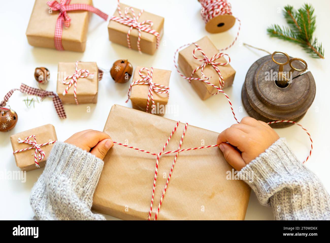11 August 2023: Child making homemade gifts and decorations for Christmas *** Kind beim Basteln von selbstgemachten Geschenken und Dekoration zu Weihnachten Stock Photo