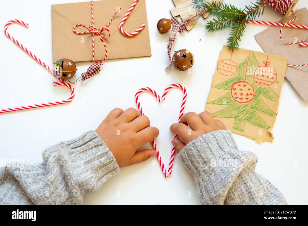 11 August 2023: Child making homemade gifts and decorations for Christmas *** Kind beim Basteln von selbstgemachten Geschenken und Dekoration zu Weihnachten Stock Photo