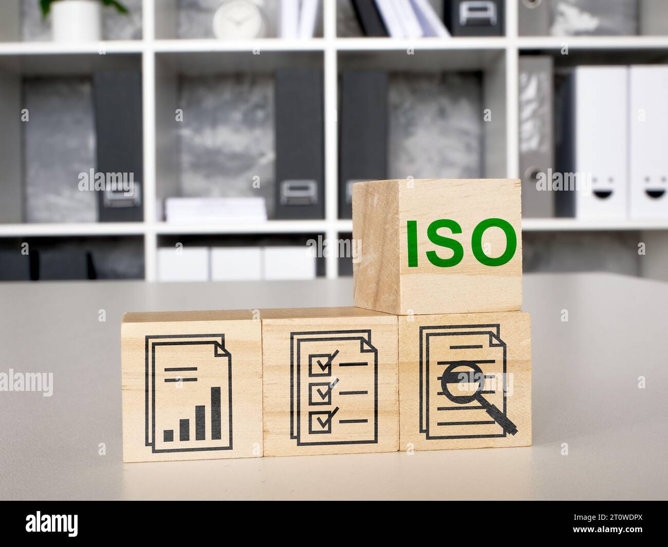 Cubes with marks for ISO quality control certification. Stock Photo