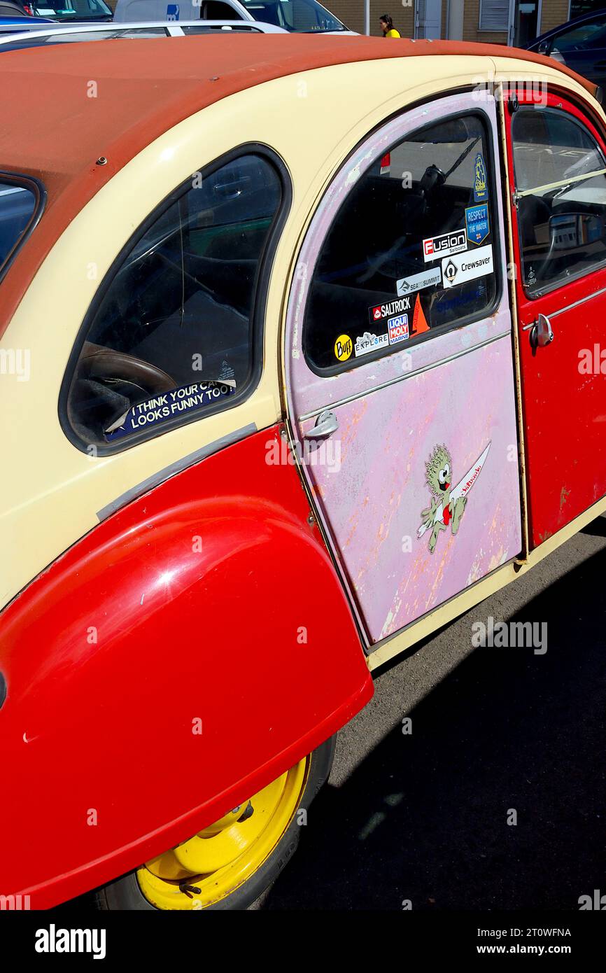 Multicoloured personalised Citroen 2CV, still going strong 32 years after production ended. The model was first introduced into the UK in 1955. Stock Photo