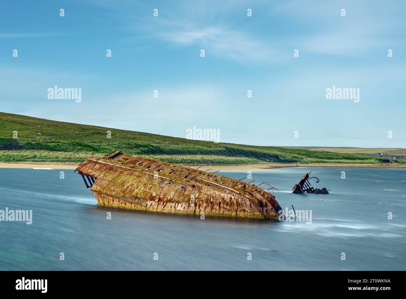 The Churchill Barriers with the wreck of the SS Reginal Blockship in Orkney, Scotland. Stock Photo