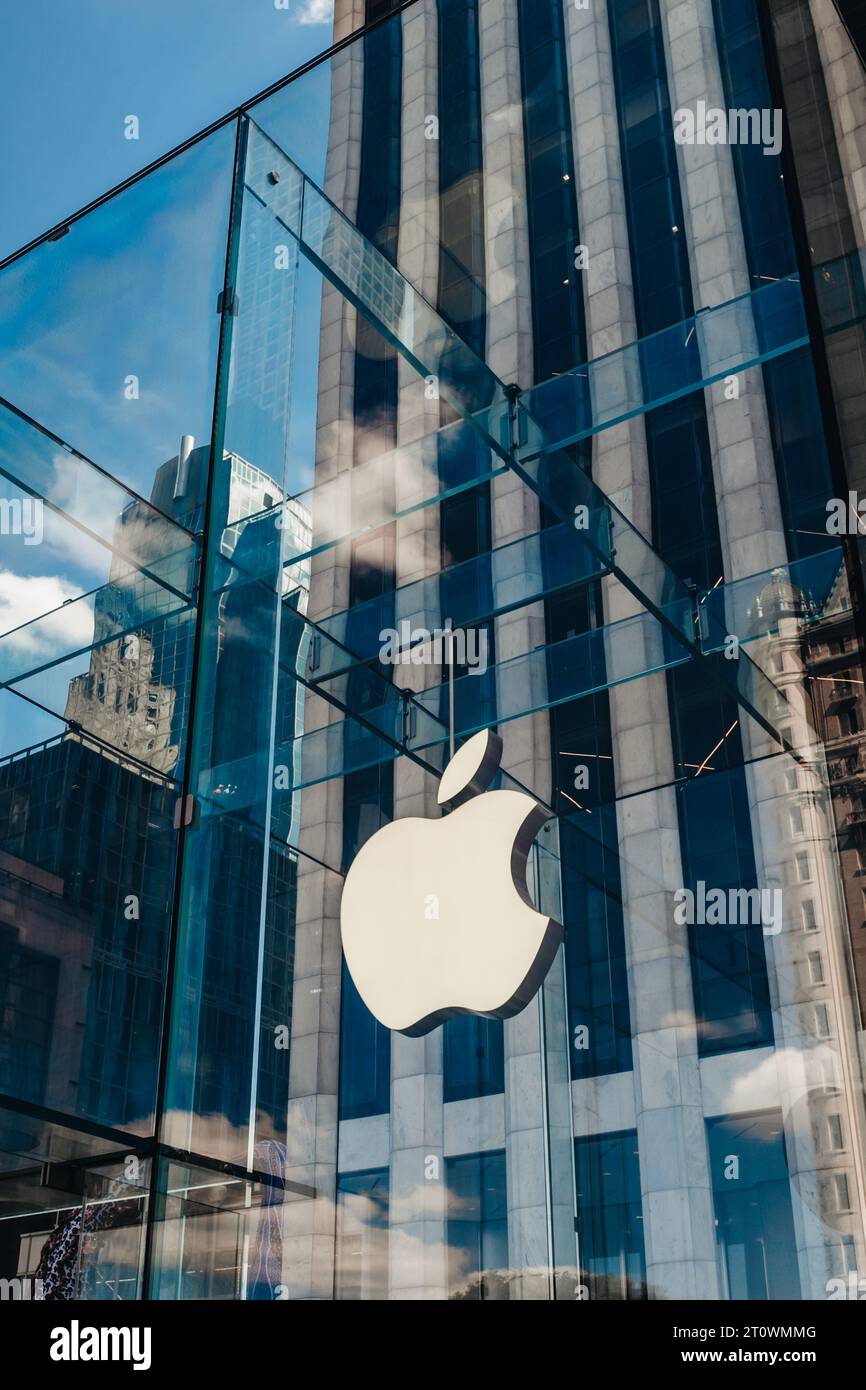 Apple Store signage at Lenox Square in the Buckhead area of Atlanta,  Georgia, with metallic Apple logo on glass reflecting a nearby skyscraper.  (USA Stock Photo - Alamy