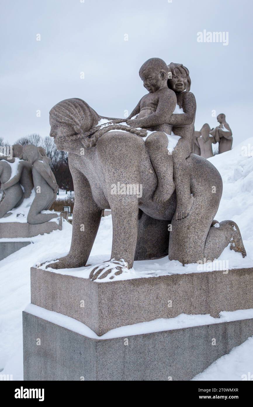 Sculptures by Gustav Vigeland at the Vigeland Installation in Frogner Park, Oslo, Norway. A mother playing with her two children Stock Photo
